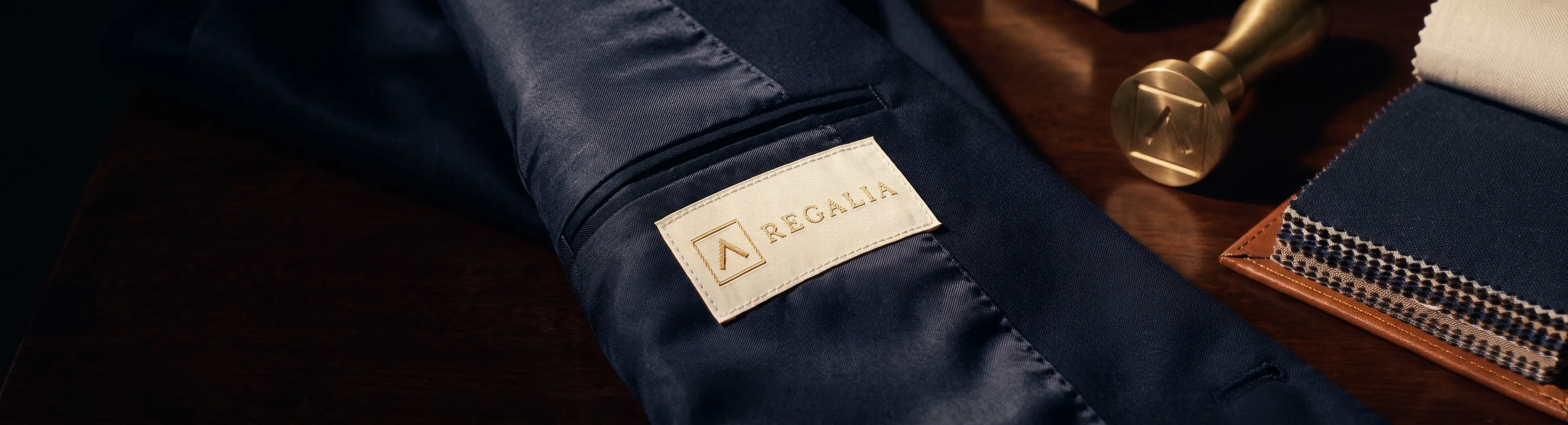 REGALIA label on navy jacket lining beside seal and cloth swatches